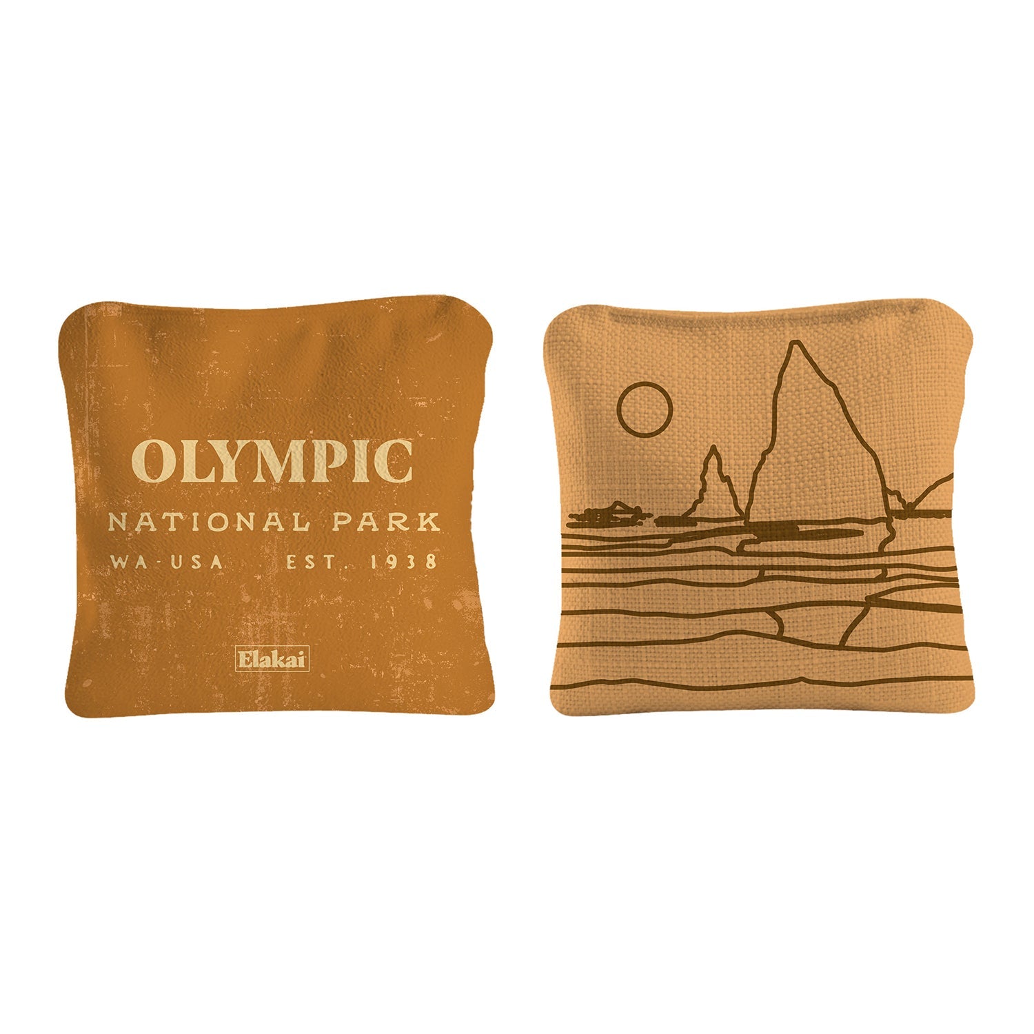 Two brown pillows with 'Olympic National Park' text and mountain design on a white background