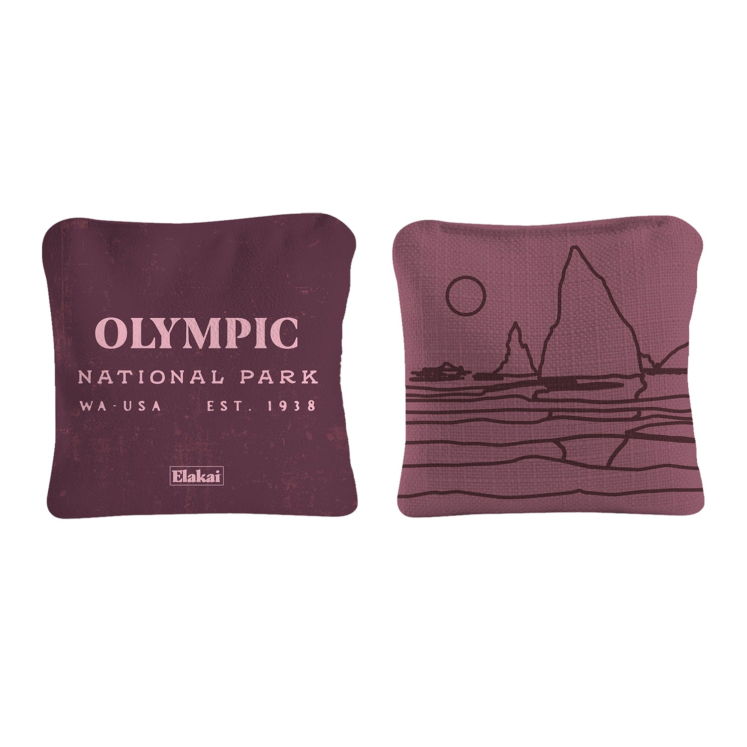 Two maroon pillows with 'Olympic National Park' text and a mountain illustration on a white background.