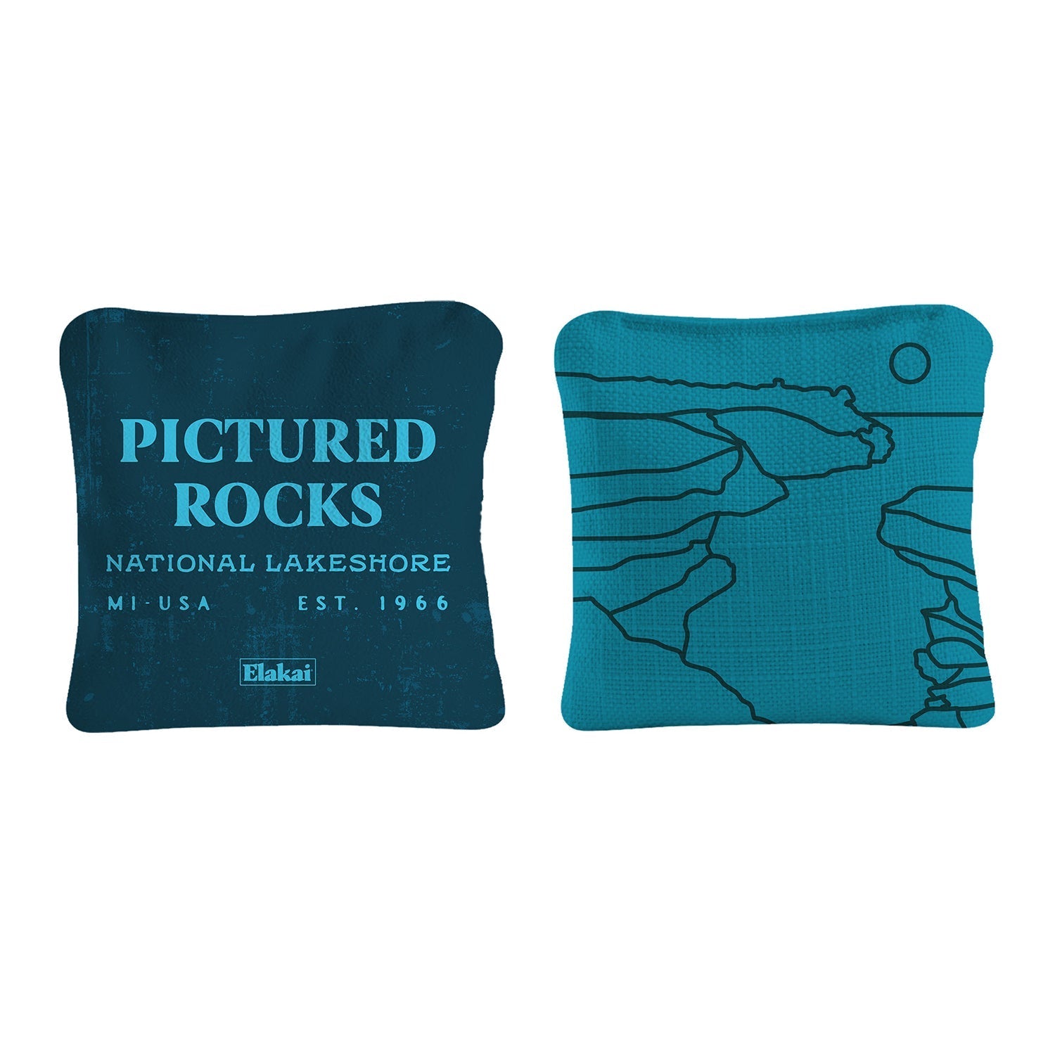 Two blue pillows with 'Pictured Rocks National Lakeshore' text and map design on a white background.