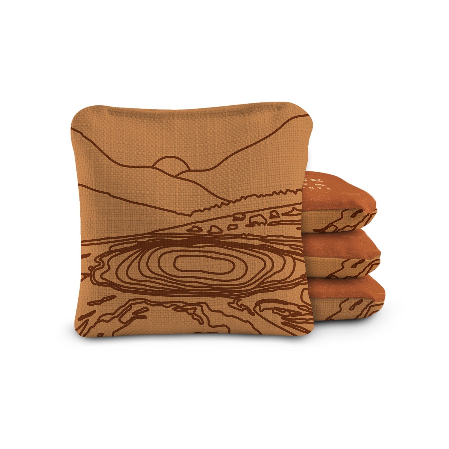 Stack of brown towels with landscape design on a white background