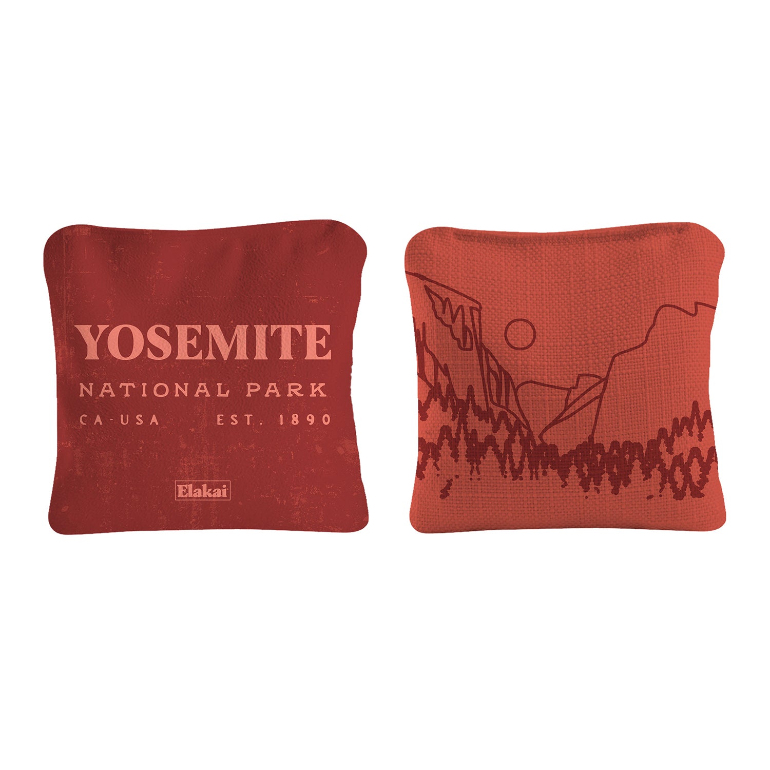 Two red pillows with Yosemite National Park design on a white background