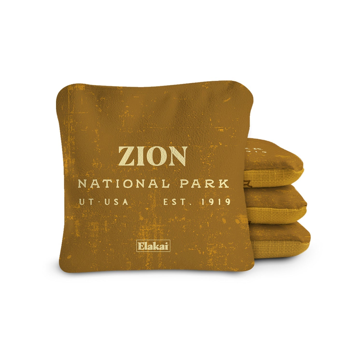 Brown pillow with 'Zion National Park' text on a white background