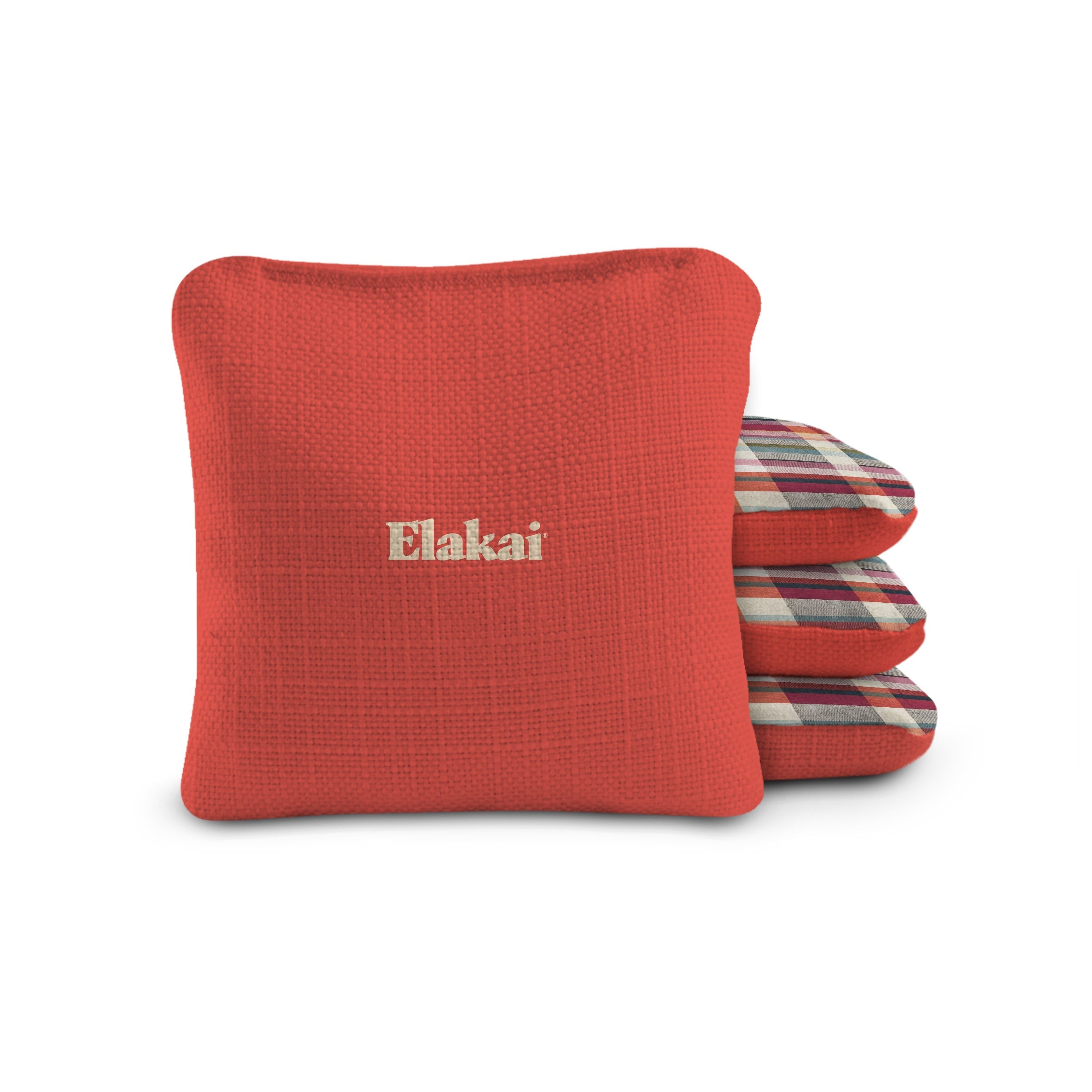 Red pillow with 'Elakai' branding on a white background