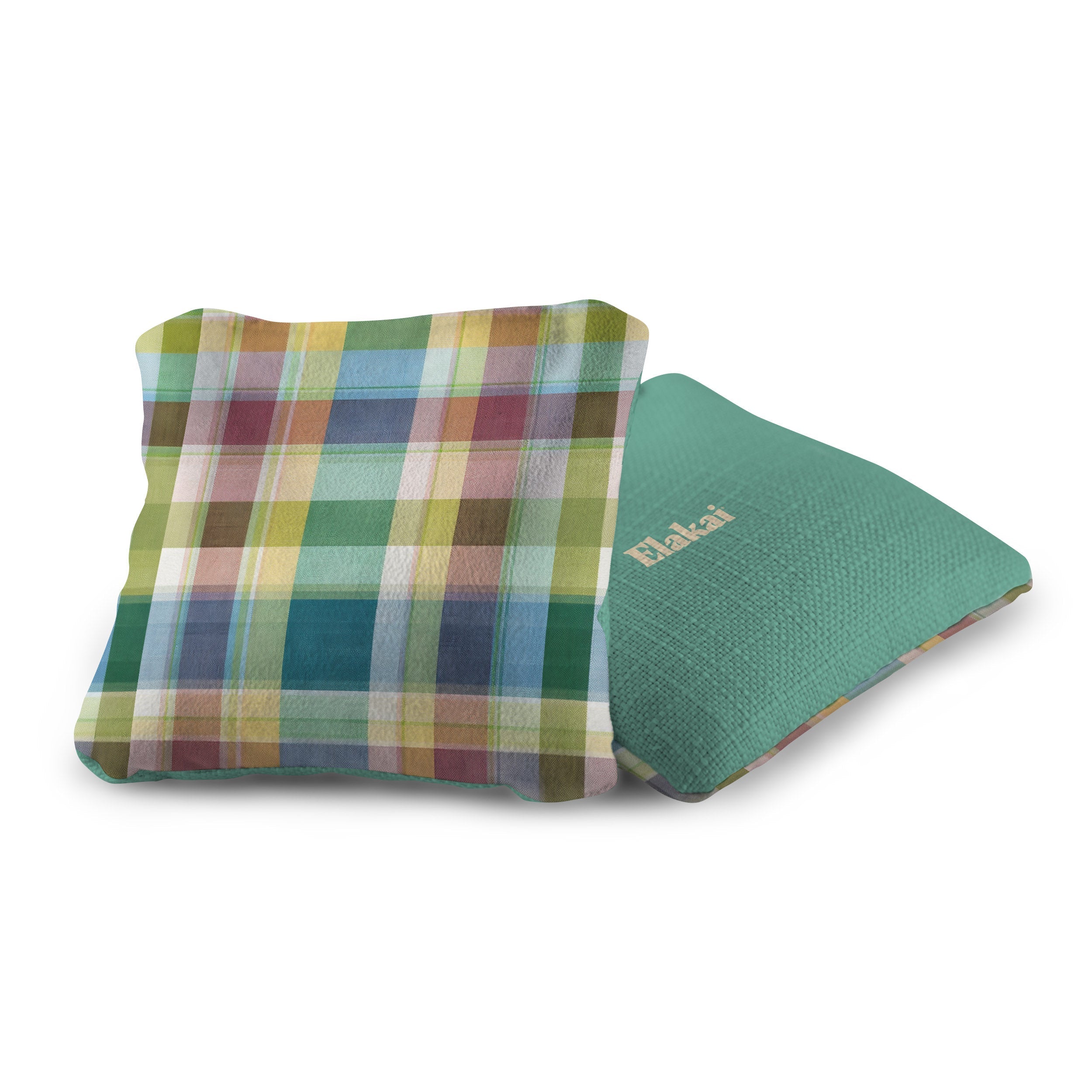 Plaid fabric pouch and green textured mat on a white background