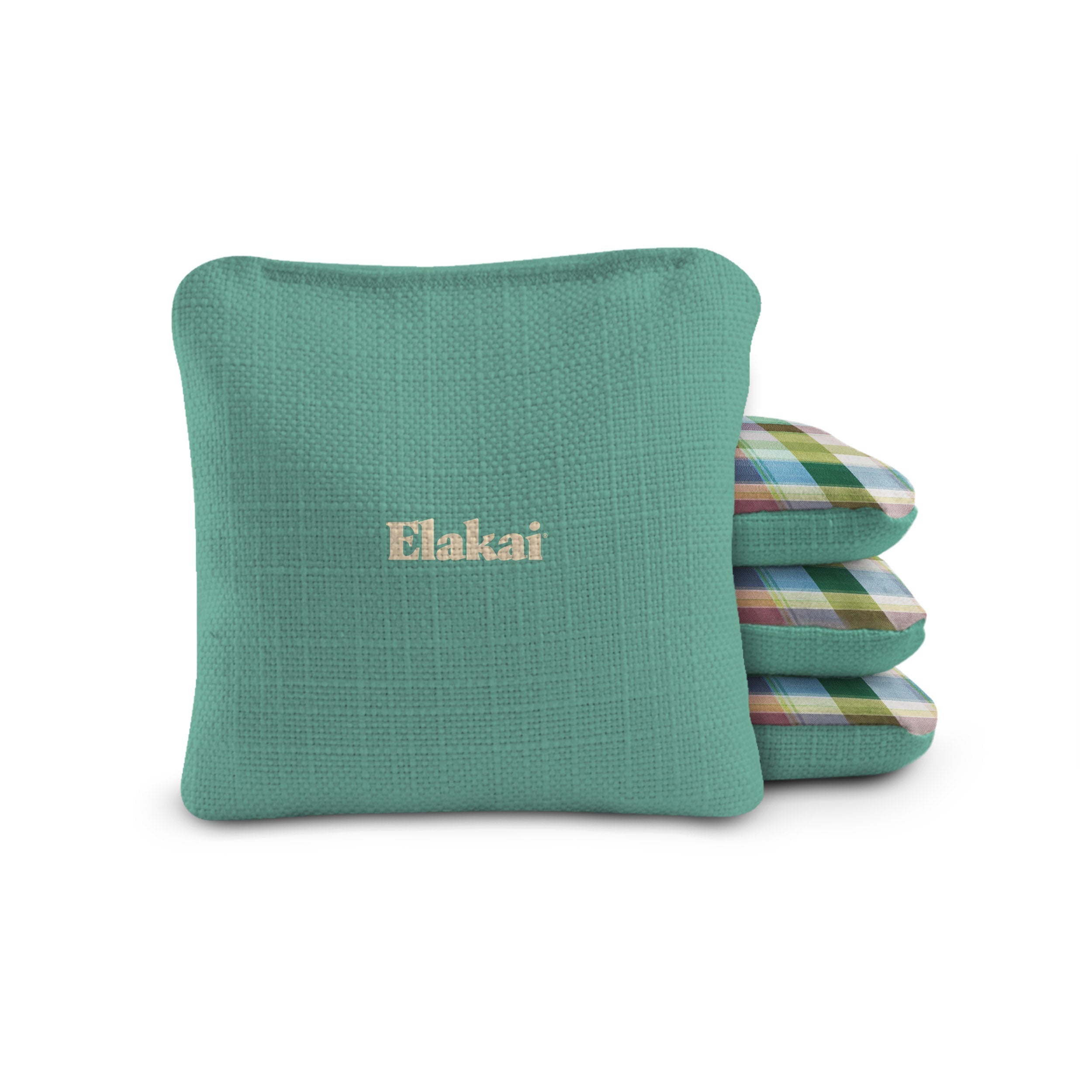 Green pillow with 'Elakai' branding on a white background