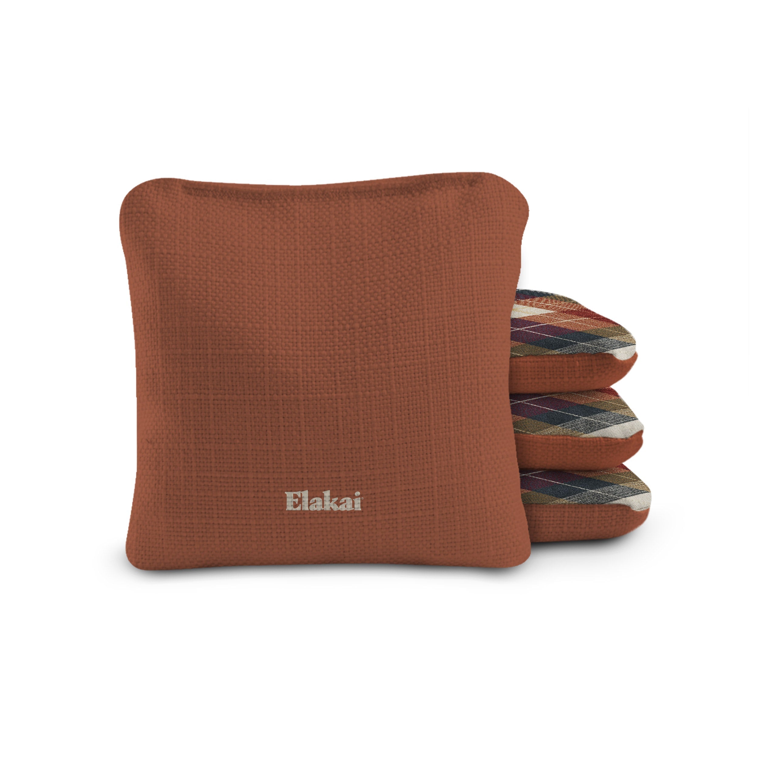 Brown pillow with 'Elakai' branding on a white background