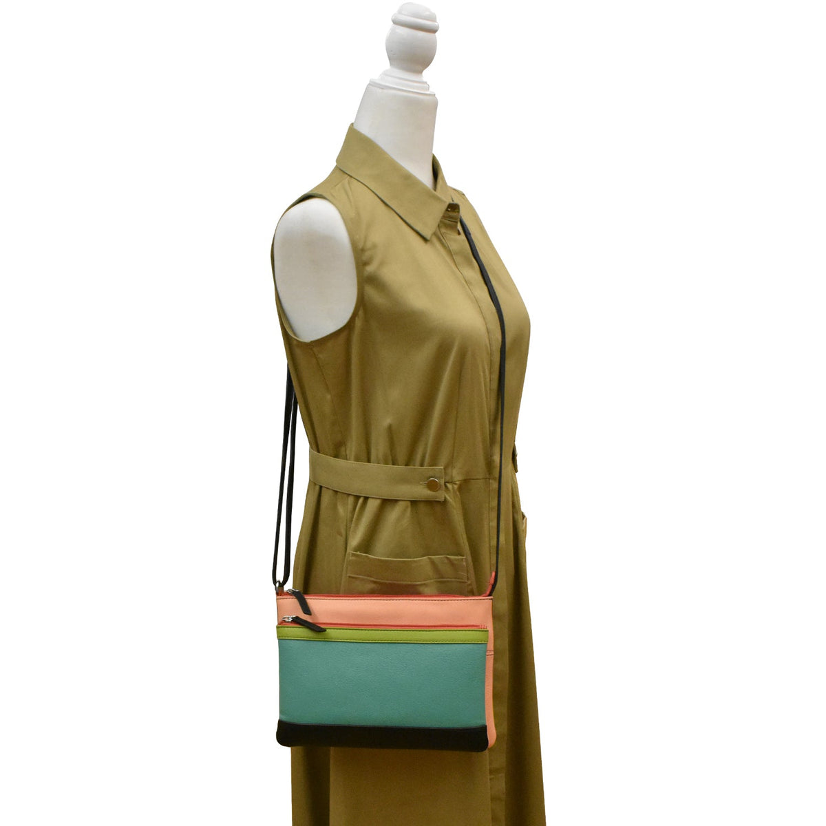 Green vest with a colorful bag on a mannequin against a white background