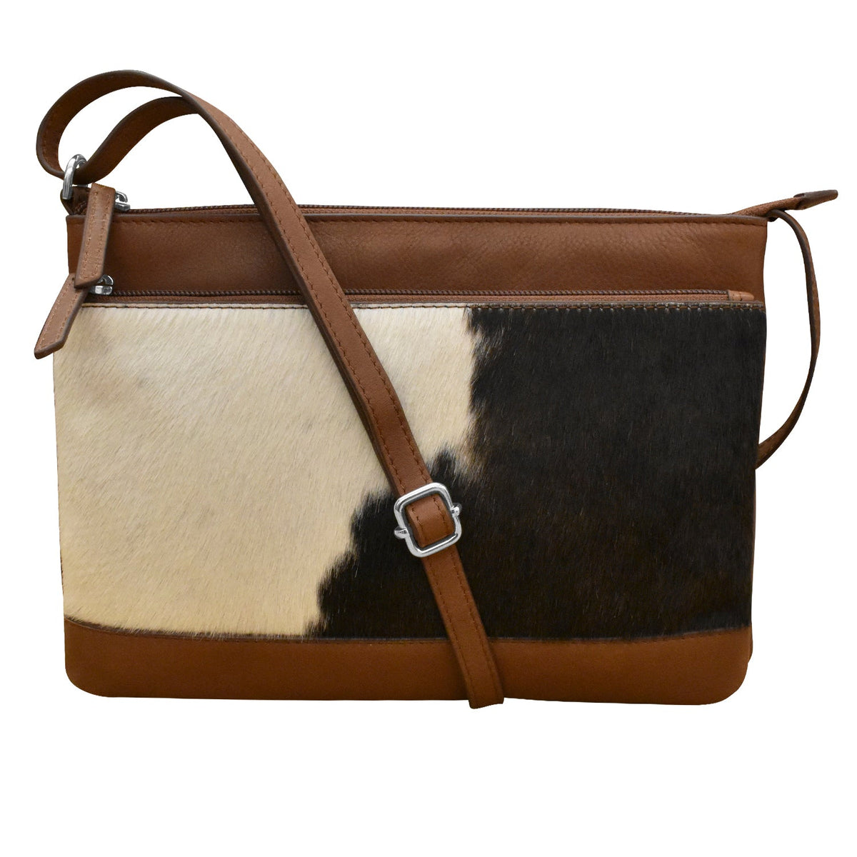 Brown leather and cowhide patterned handbag on a white background