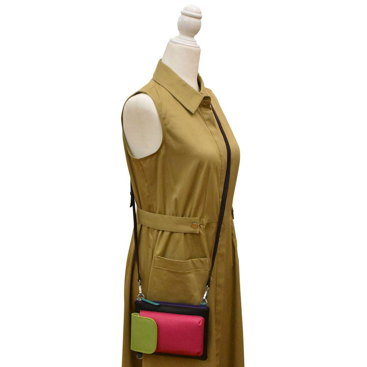 Mannequin wearing a beige sleeveless dress with a colorful bag attached.
