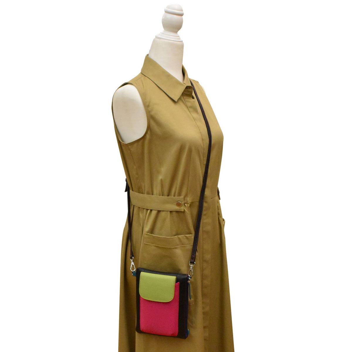Mannequin wearing a brown dress with a colorful pocket on a white background