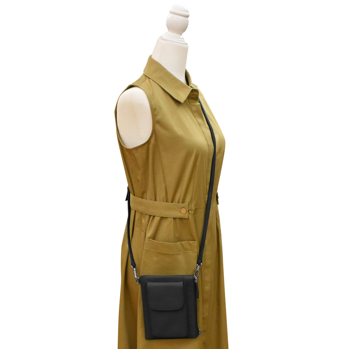 Mannequin wearing a mustard yellow dress with a black crossbody bag on a white background