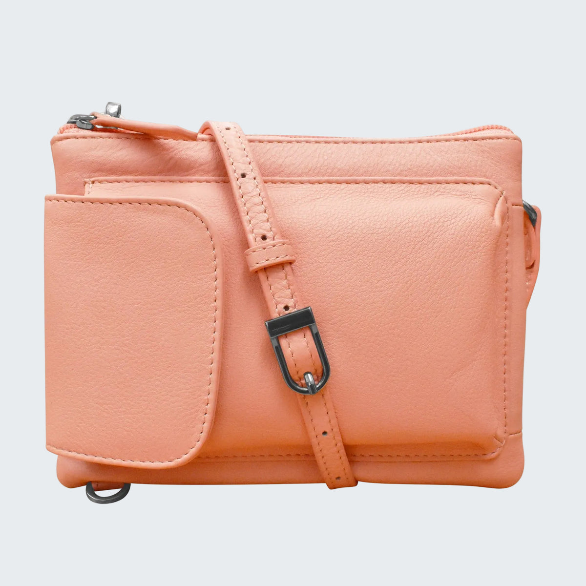 Pink leather crossbody bag with strap on a white background