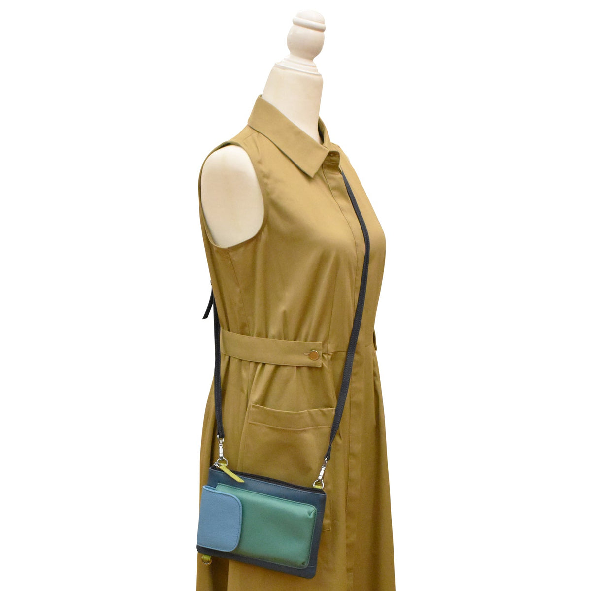 Mannequin wearing a mustard yellow dress with a crossbody bag on a white background