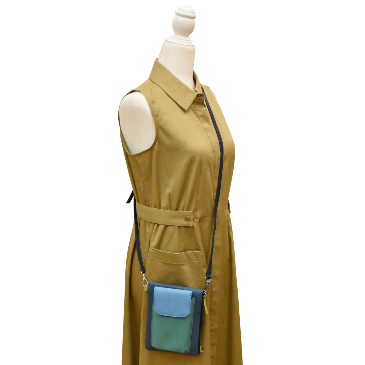 Mannequin wearing a mustard yellow dress with a blue and green crossbody bag.