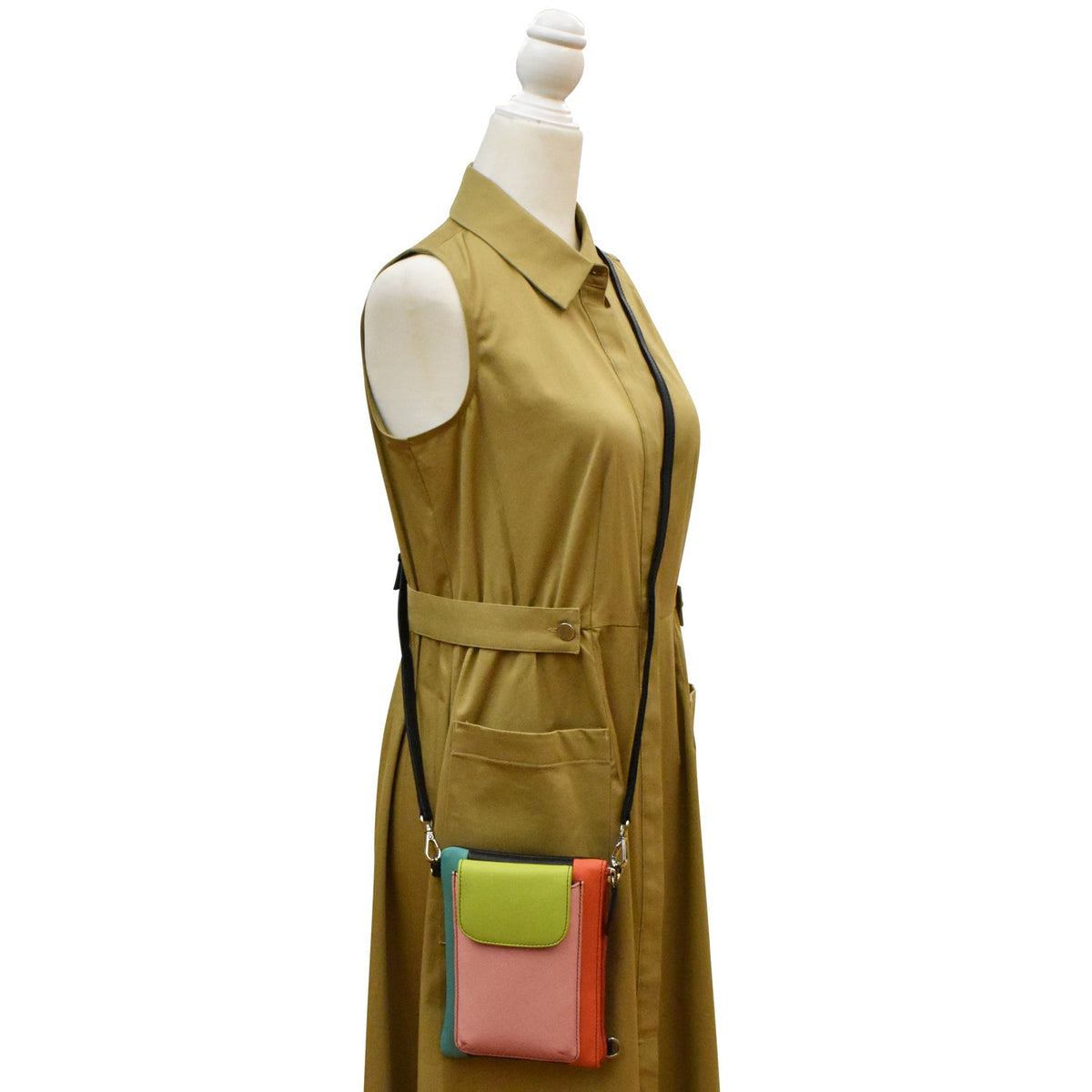 Mannequin wearing a mustard yellow dress with a colorful crossbody bag on a white background
