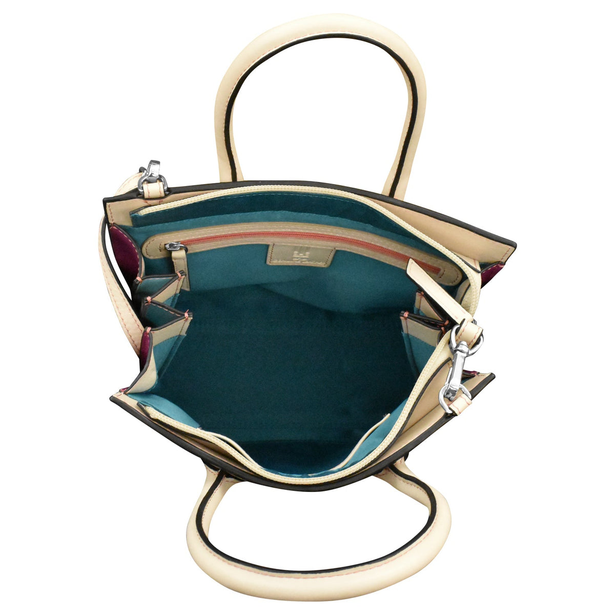 Open handbag with teal interior and gold exterior on a white background