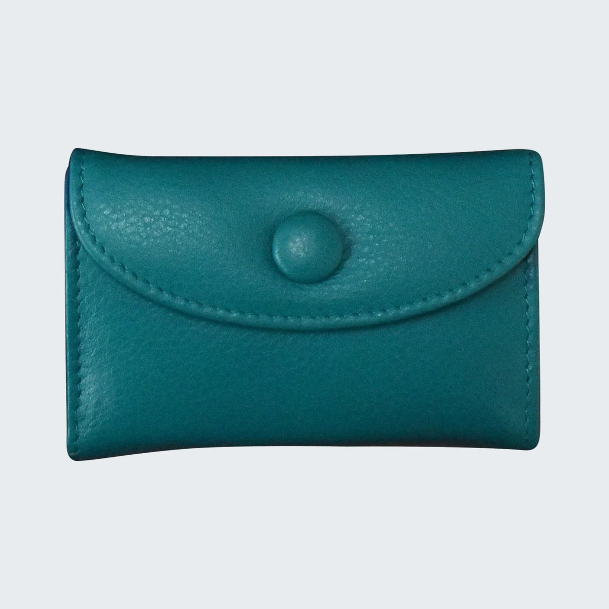 Teal leather cardholder with a button on a white background