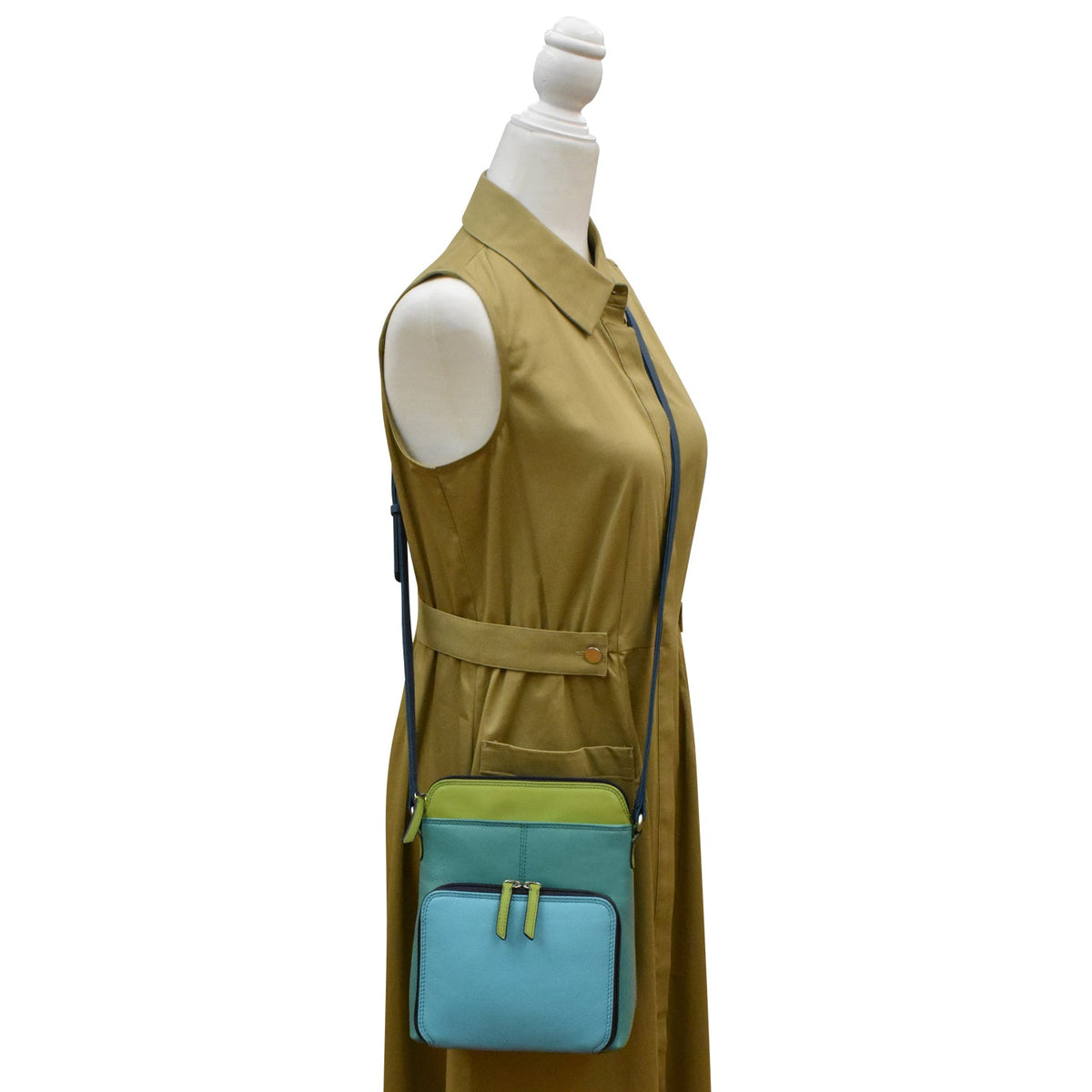 Mannequin wearing a beige dress with a blue and green crossbody bag on a white background