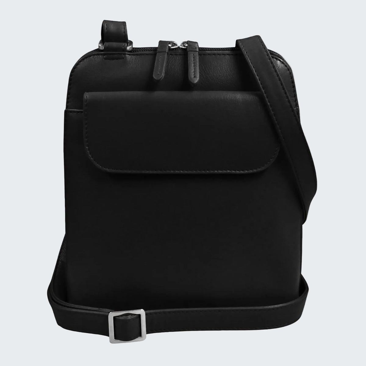 A black faux-leather crossbody bag with a front flap pocket, dual zipper top, and adjustable shoulder strap with a silver buckle, shown on a plain white background.