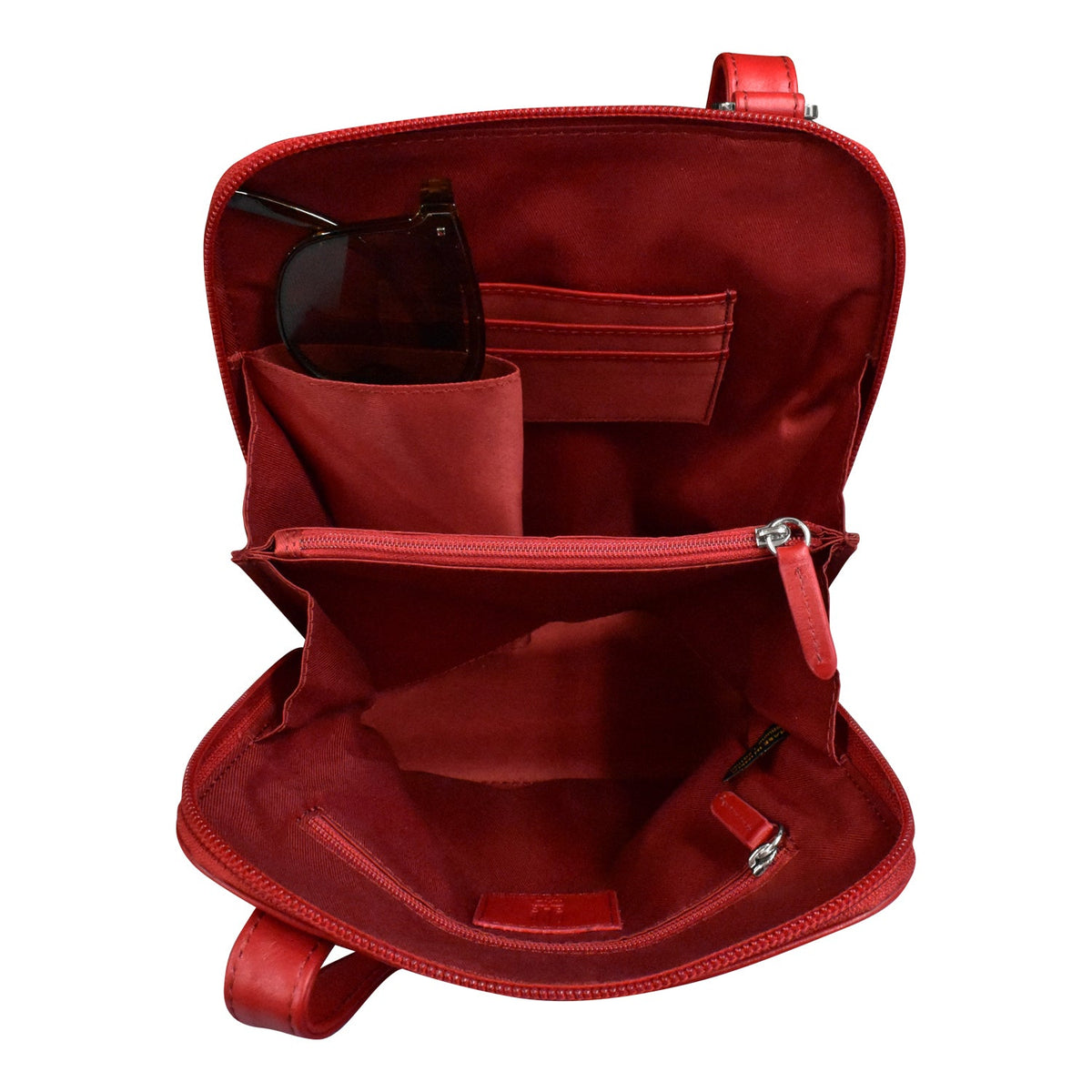 Red backpack with multiple compartments on a white background