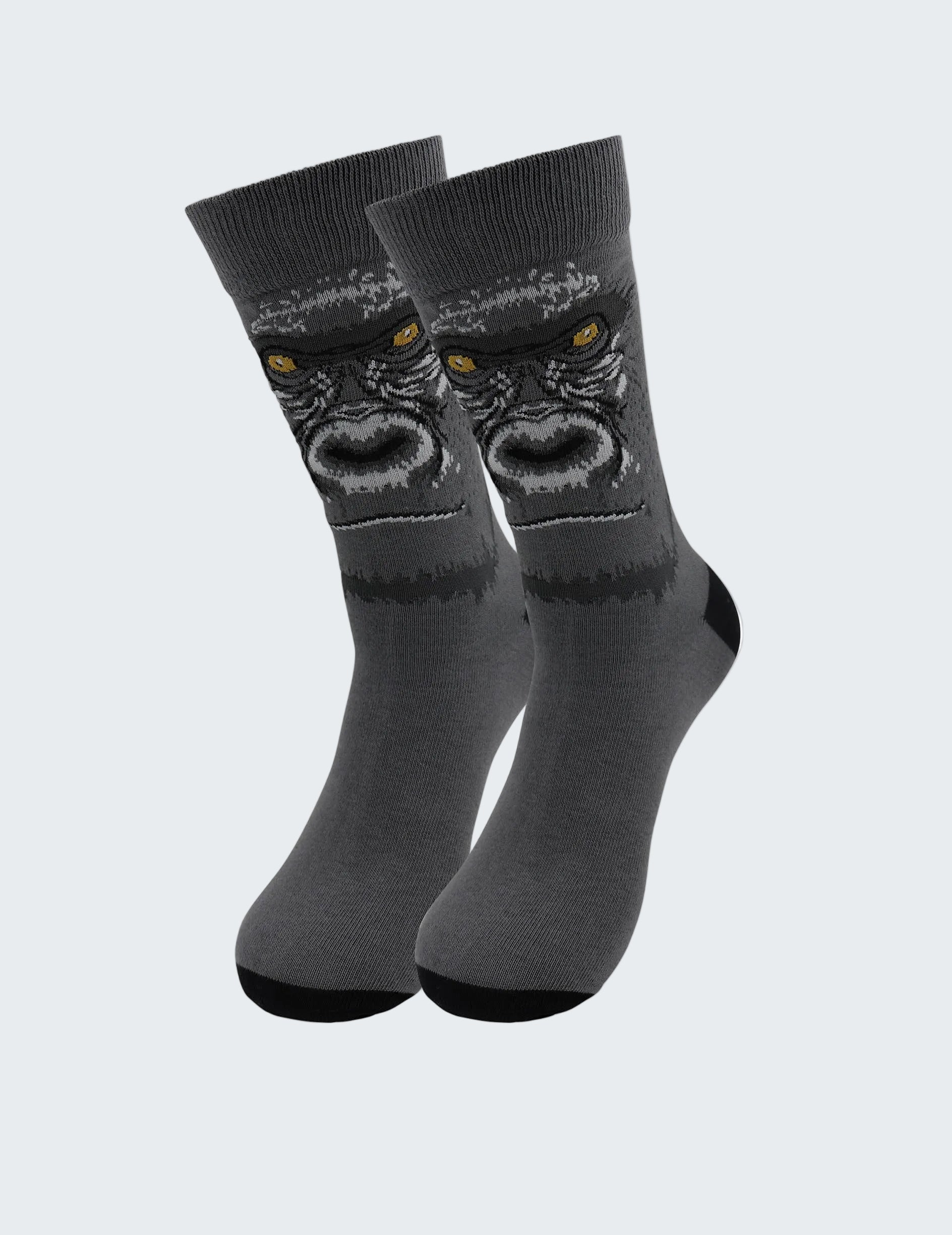 Gray socks with a gorilla design on a white background