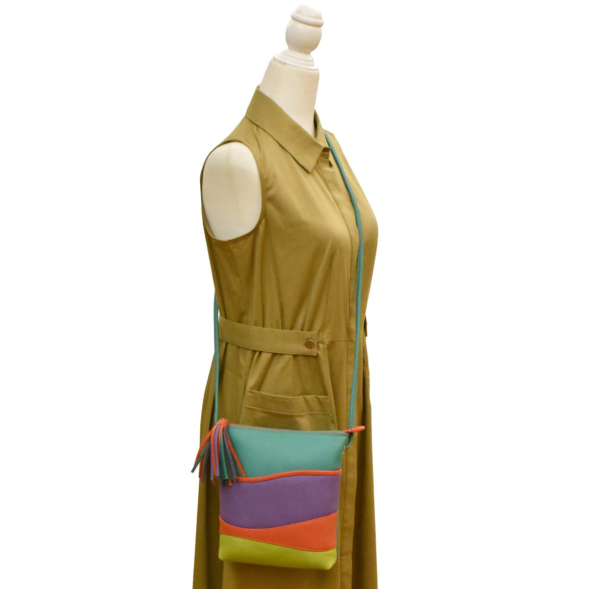 Mannequin wearing a mustard yellow dress with a colorful crossbody bag on a white background