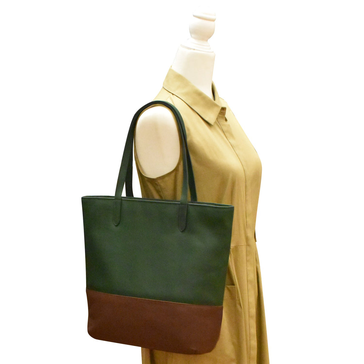 Green and brown tote bag on a mannequin with a white background