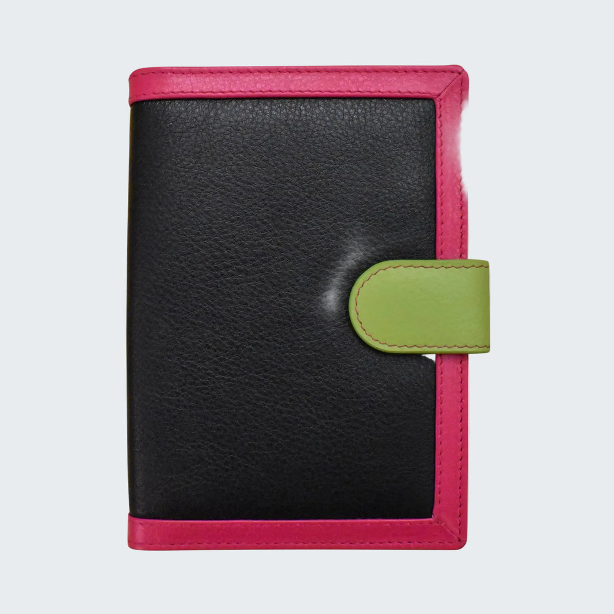 A small leather wallet or notebook cover with a black pebbled center, bright pink border, and an olive green snap tab closure, shown on a plain white background.