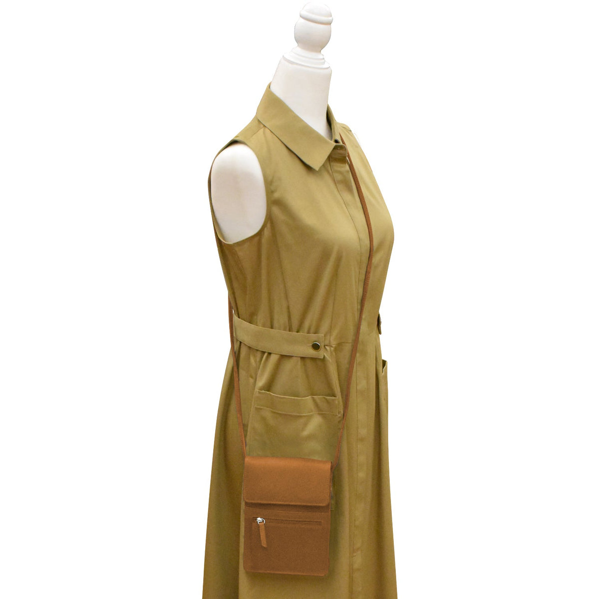 Green sleeveless dress with brown accents on a mannequin against a white background