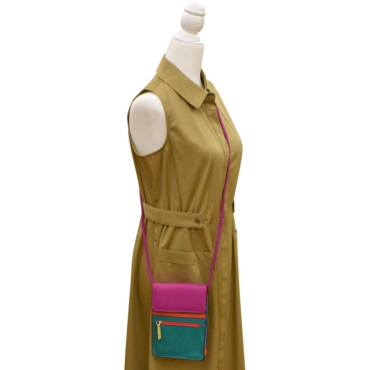 Mannequin wearing a green dress with colorful pockets on a white background