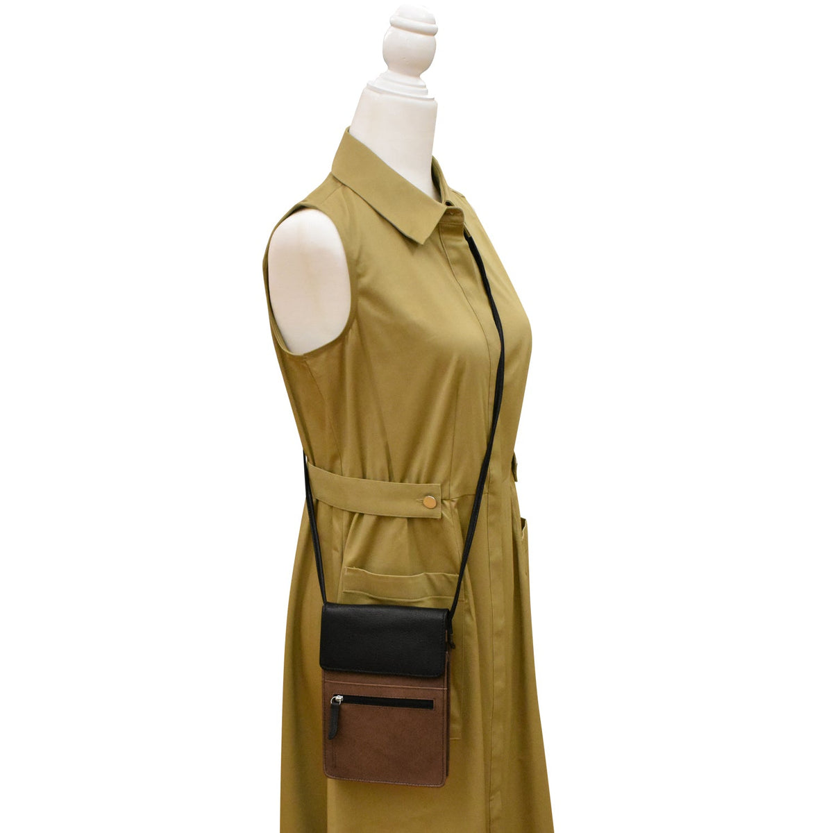Green sleeveless jacket with black and brown accents on a mannequin against a white background
