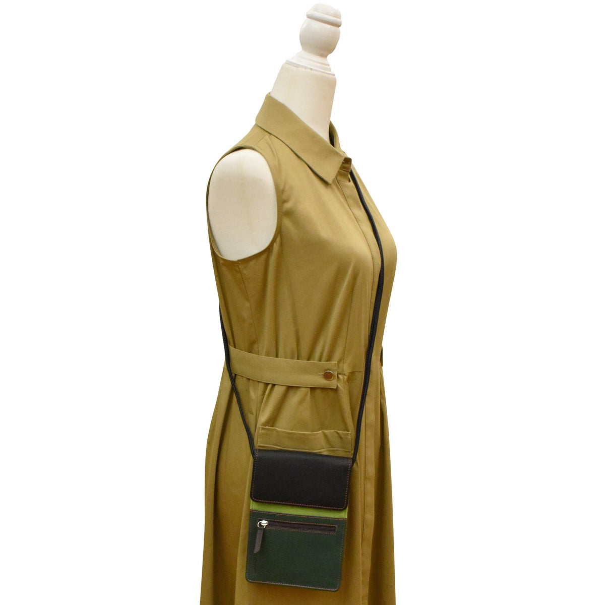 Green sleeveless dress with a belt and pocket on a mannequin against a white background