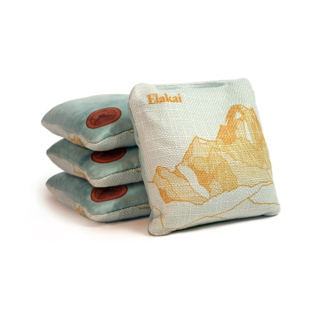Three bean bags with mountain design and 'Elakali' branding on a white background