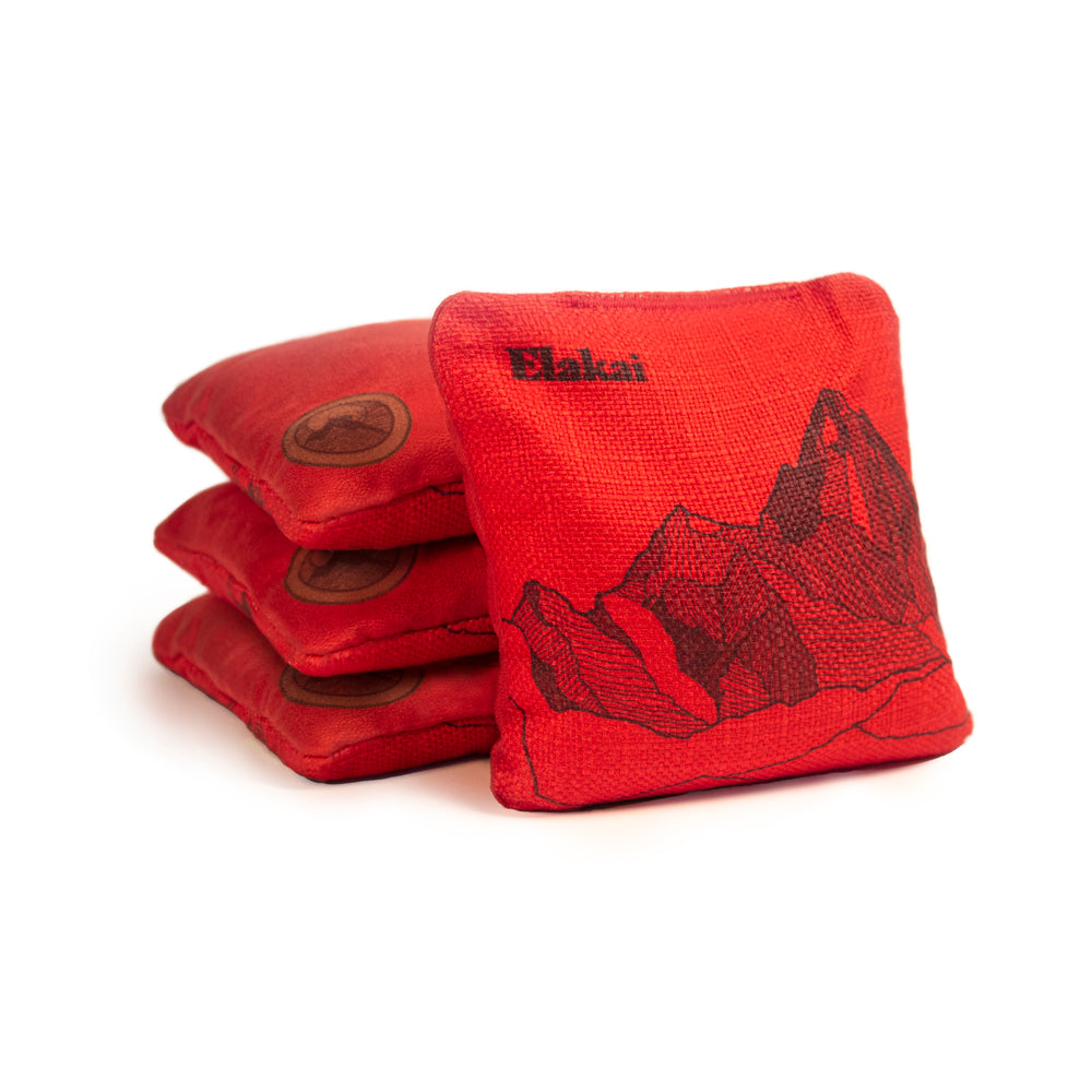Red bean bags with mountain design and 'Elakai' branding on a white background