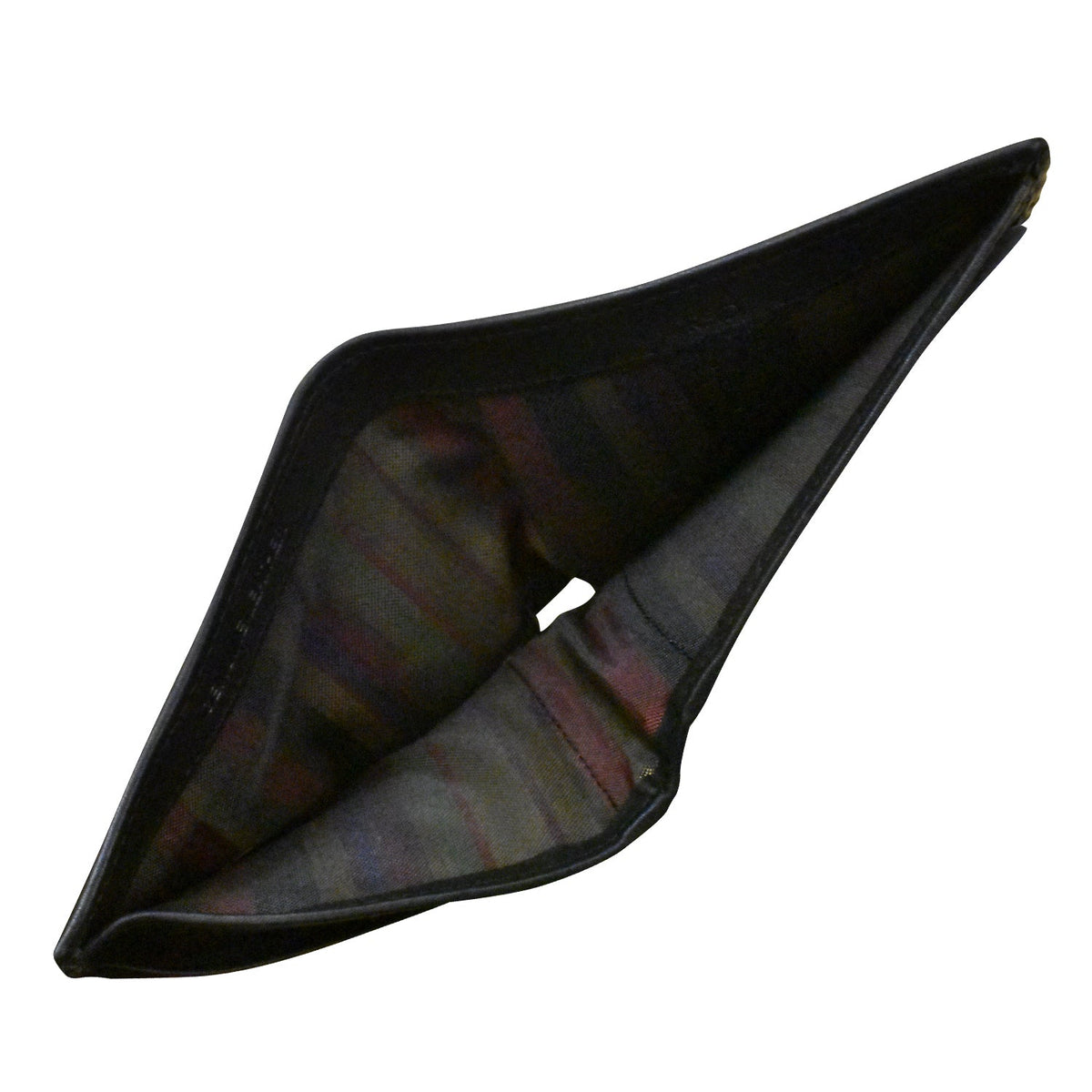 Black plastic object with a textured surface on a white background