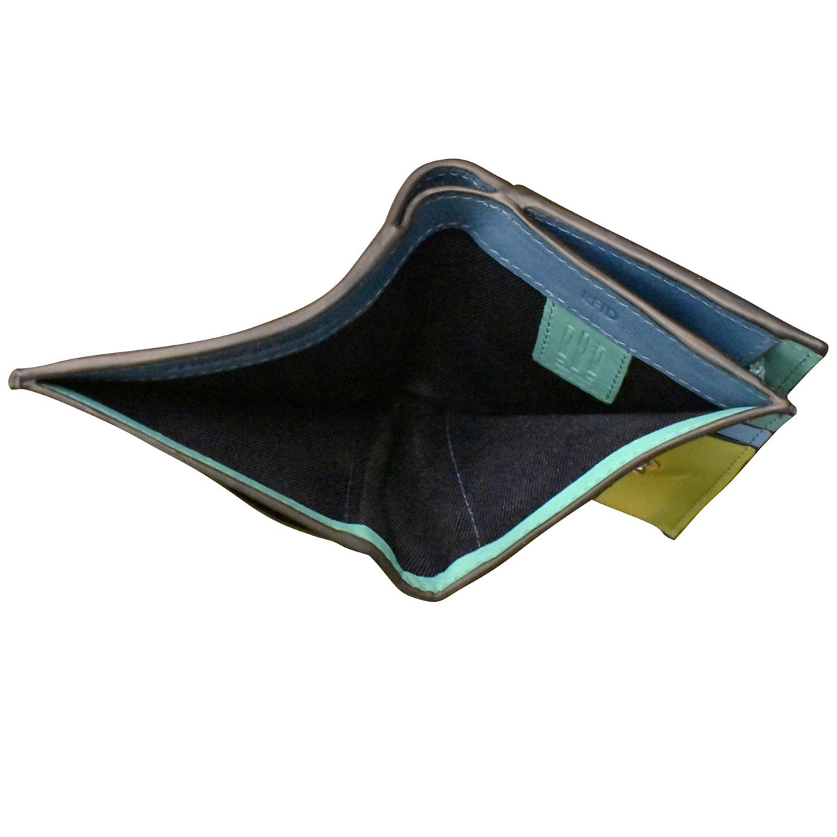 Open blue and green fabric pouch on a white background
