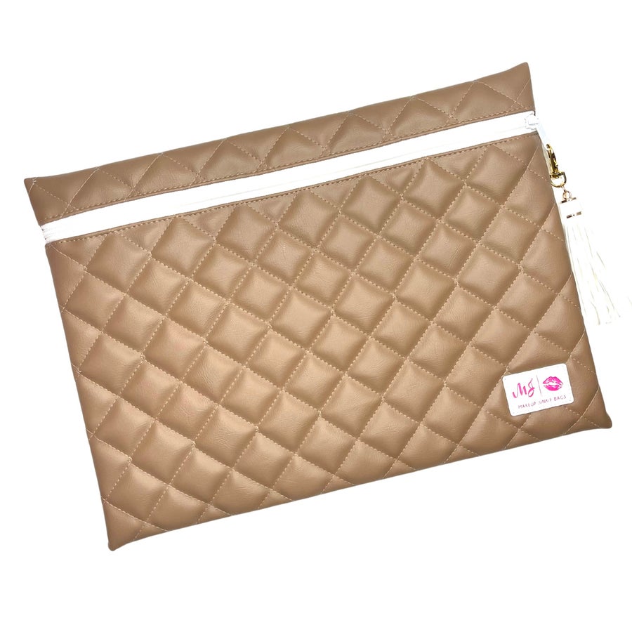 Quilted beige pouch with a visible brand label on a white background