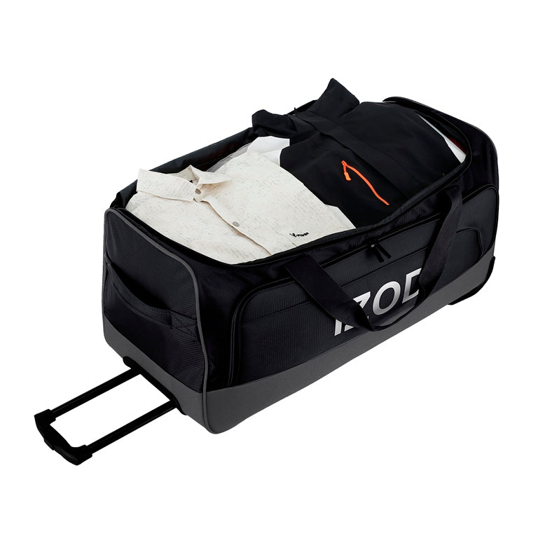 Black travel duffel bag with clothes inside on a white background