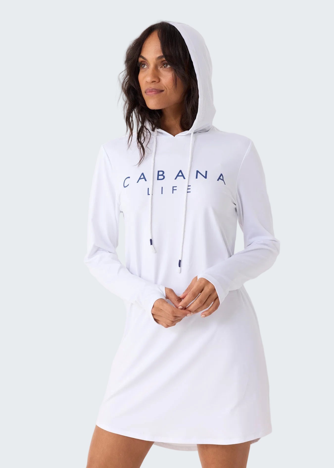 Woman wearing a white hoodie with 'CABANA LIFE' text on a plain background