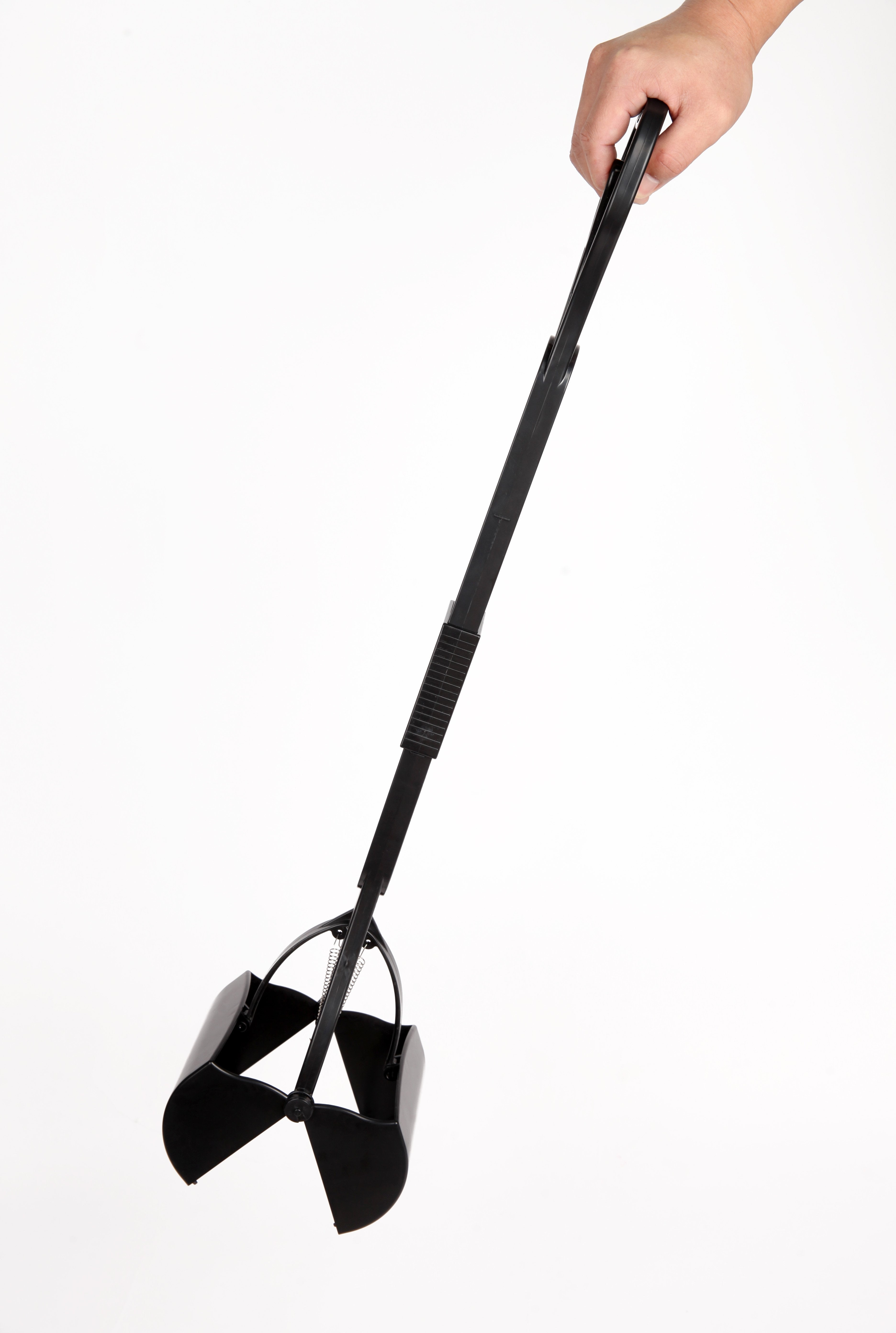 Black garden shovel held by a hand on a white background