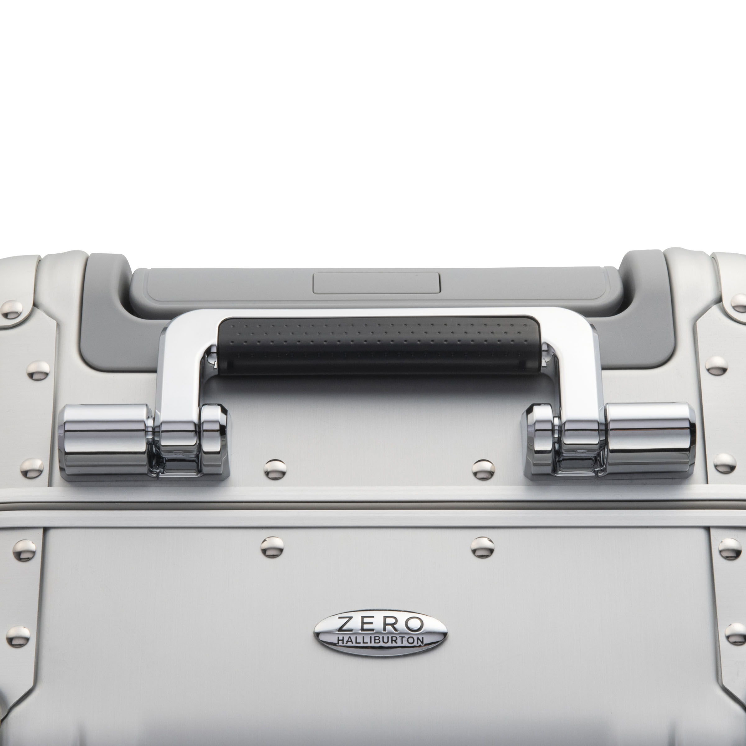 Silver Zero Halliburton suitcase with handle on a white background