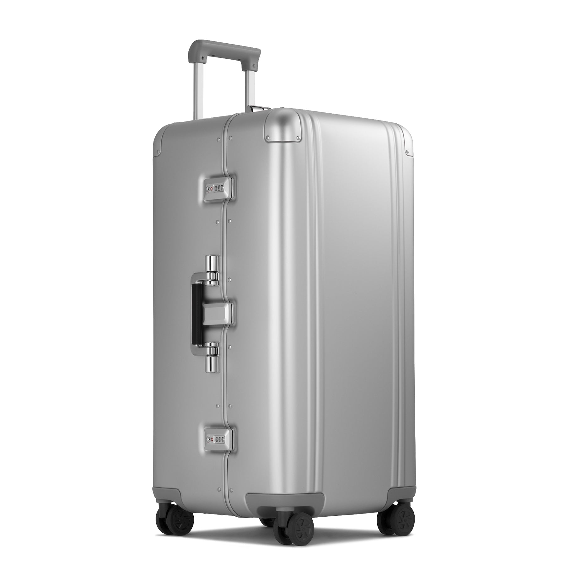 Silver suitcase with wheels and handle on a white background