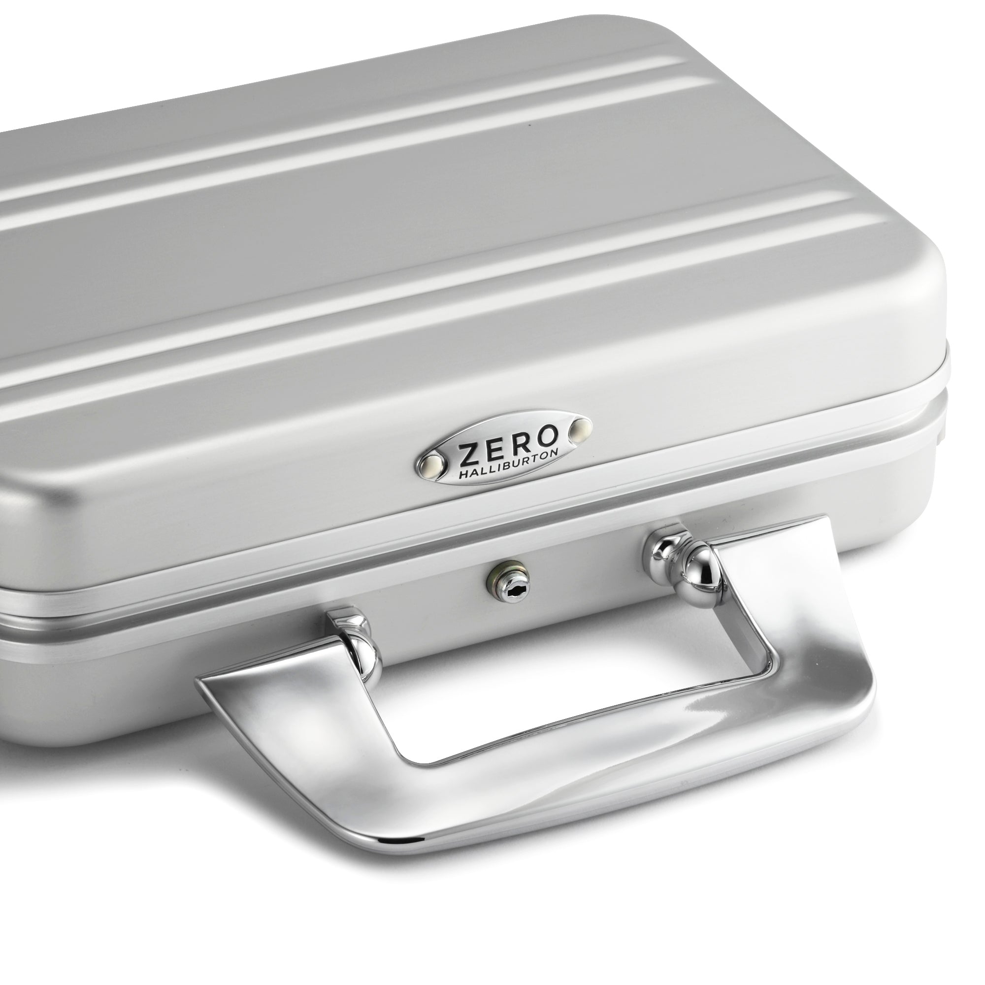 Silver metal briefcase with 'ZERO HALLIBURTON' branding on a white background