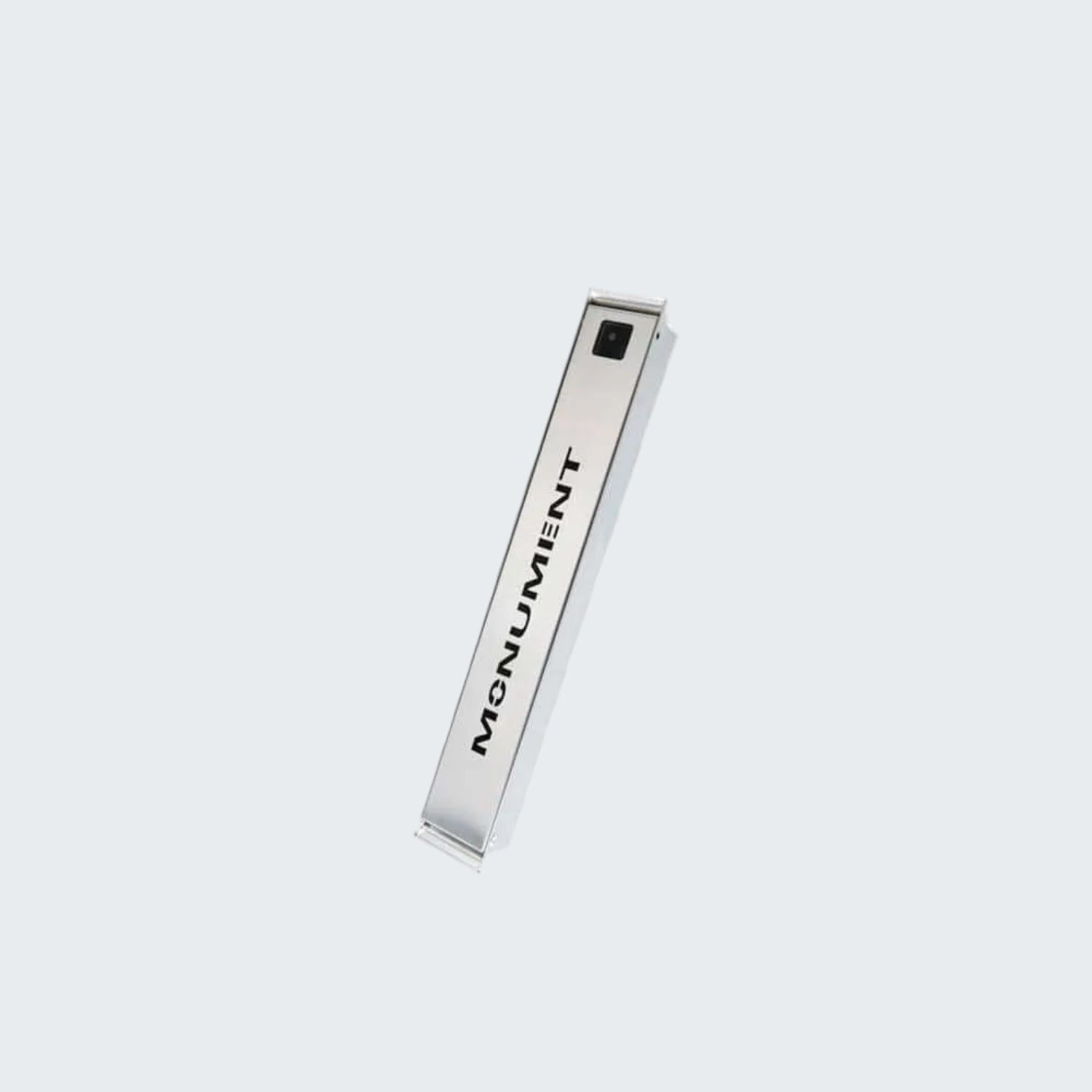 Metallic pen with 'Monument' branding on a white background