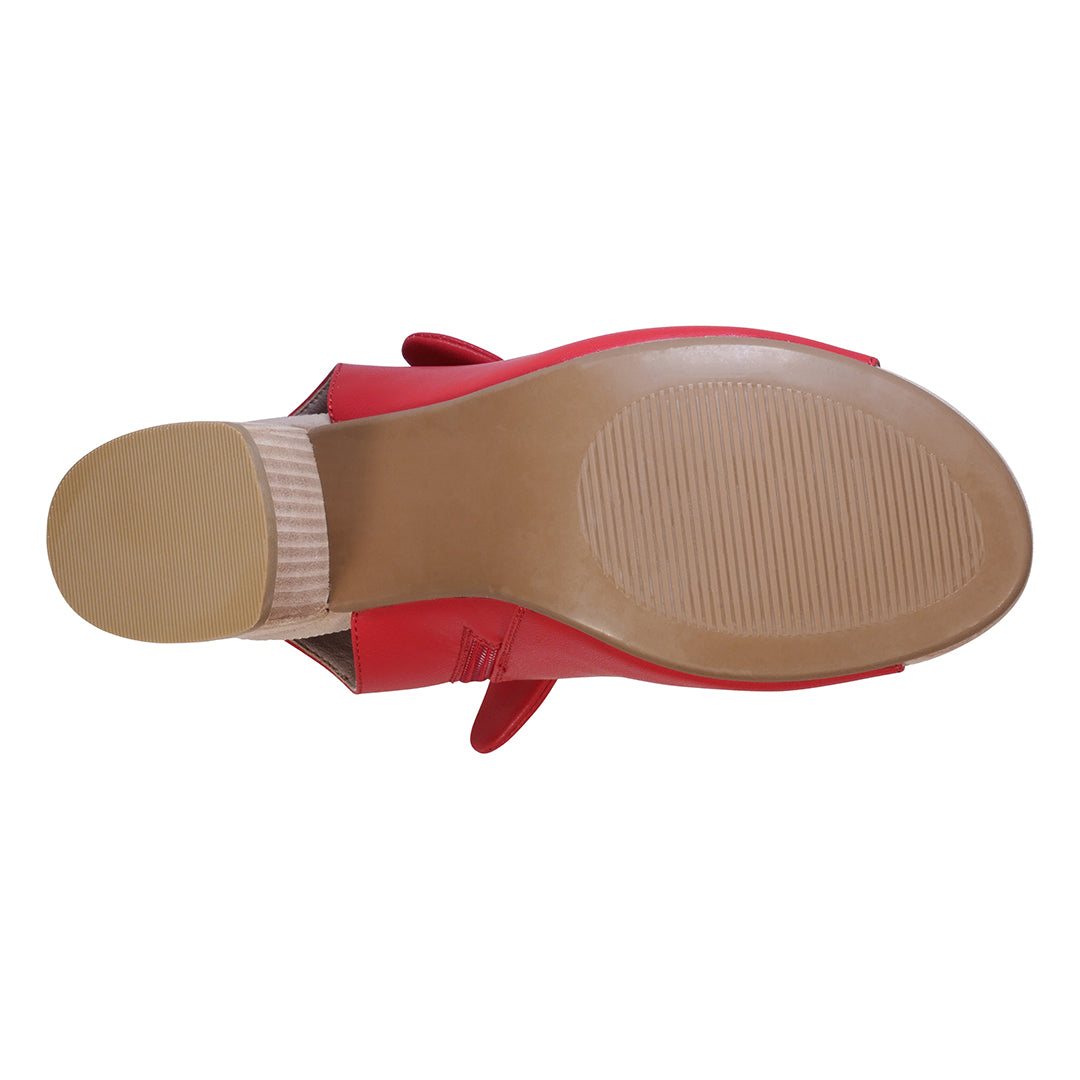 Red sandal with a tan insole on a white background