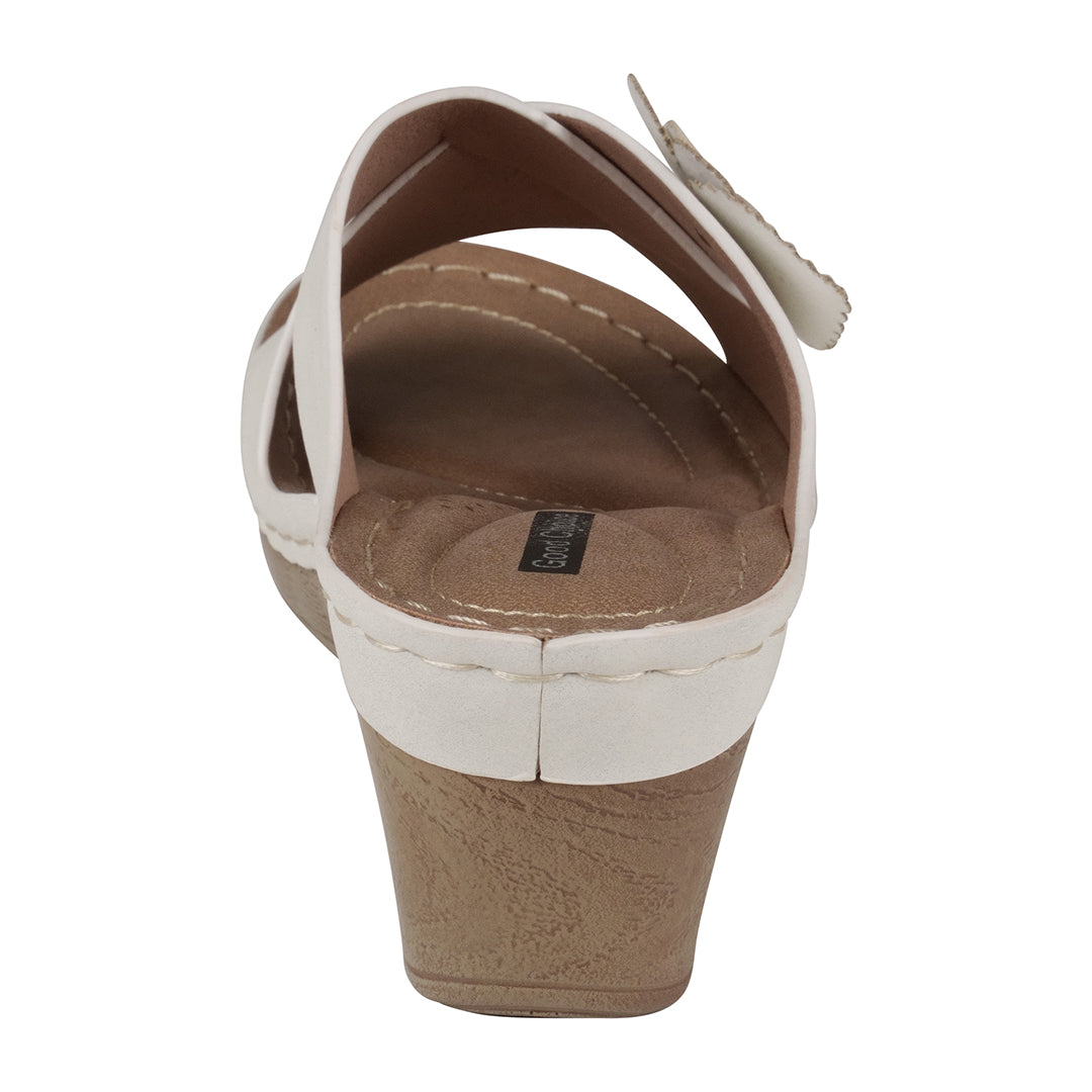 Brown wedge sandal with white strap on a white background