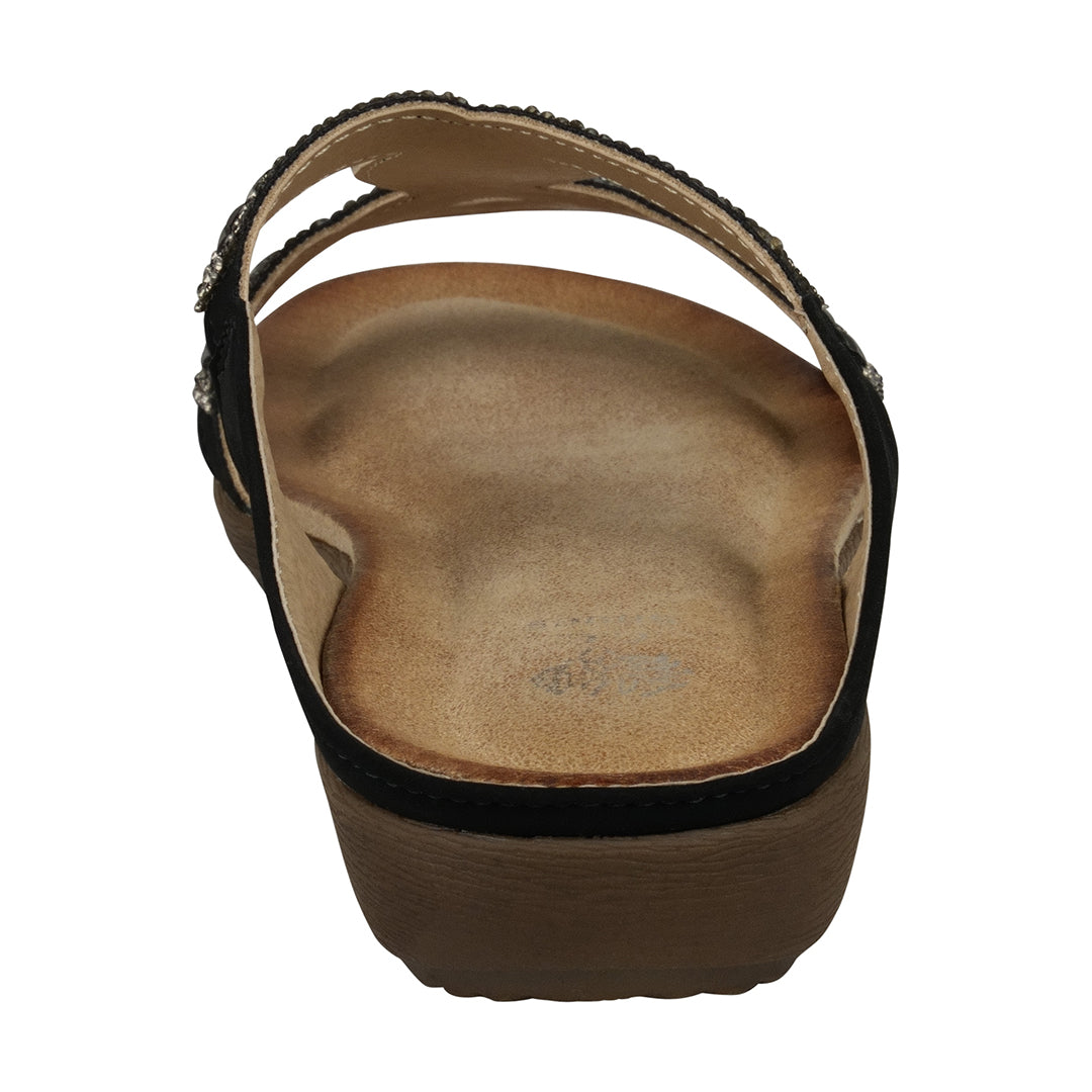 Brown sandal with a black strap on a white background