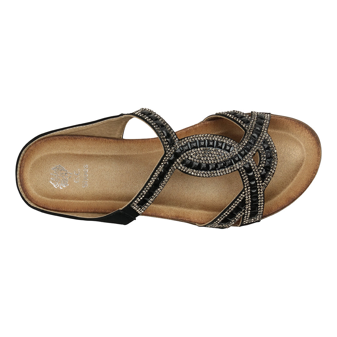 Beige sandal with decorative straps on a white background