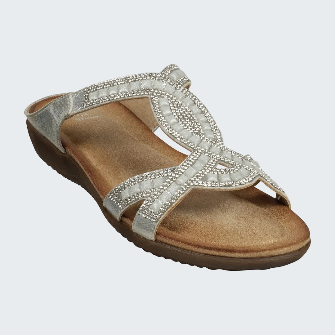 Silver sandal with embellishments on a white background