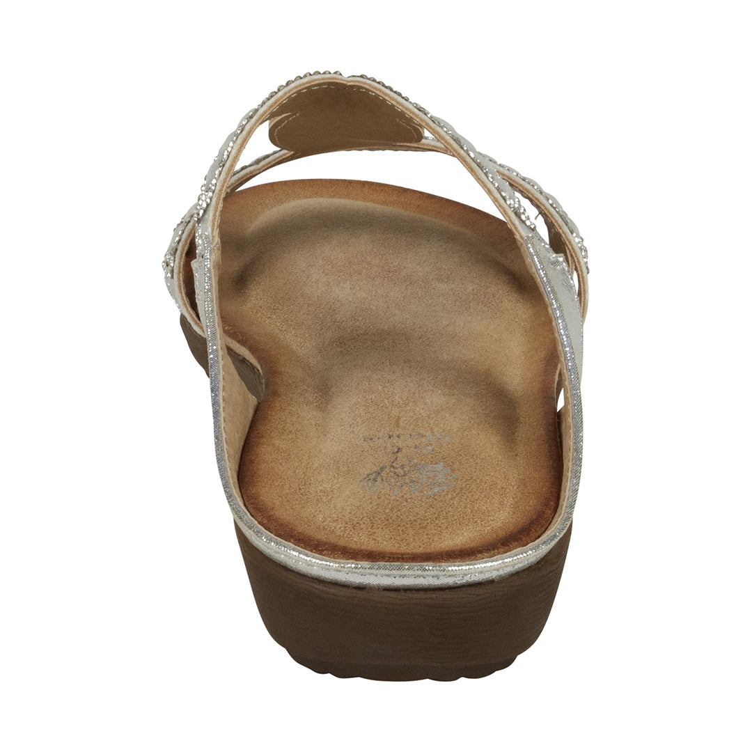 Brown sandal with a white sole on a white background